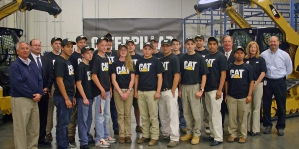 Team members posing for a photograph at Caterpillar's Sanford Facility.